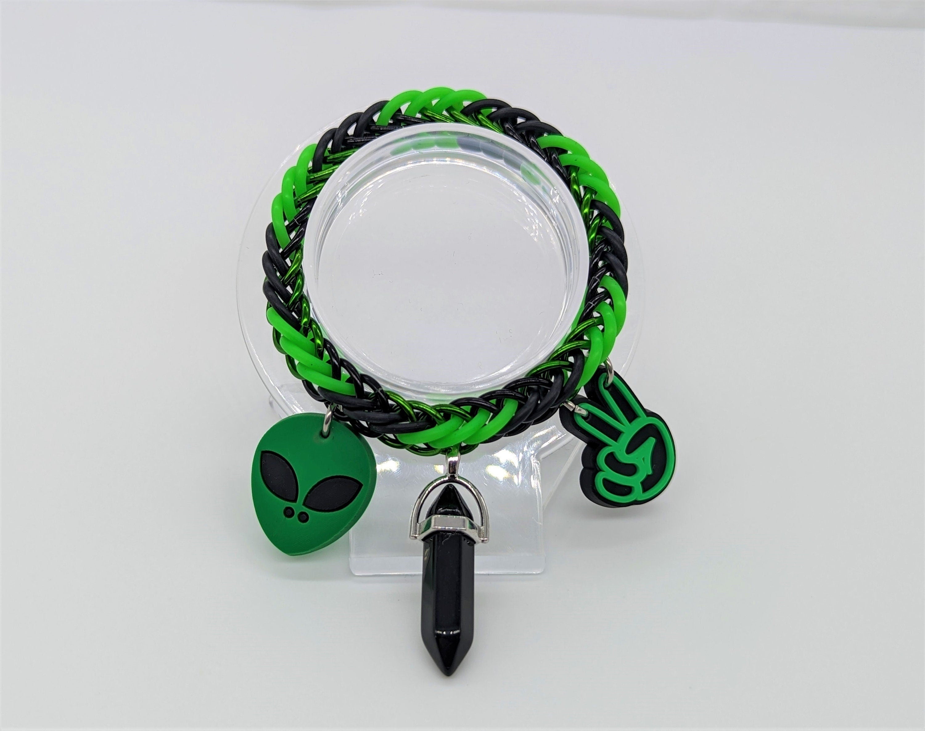 Black & Green Alien Charm Bracelet Place In Stand Front View