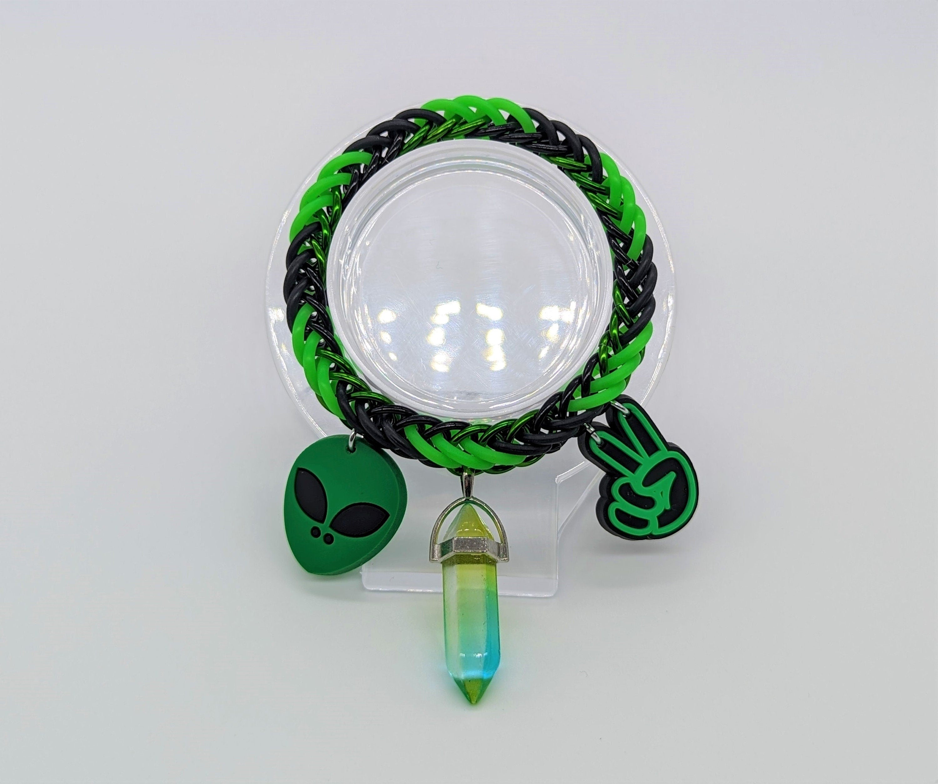 Black & Green Alien Charm Bracelet Place in Stand
